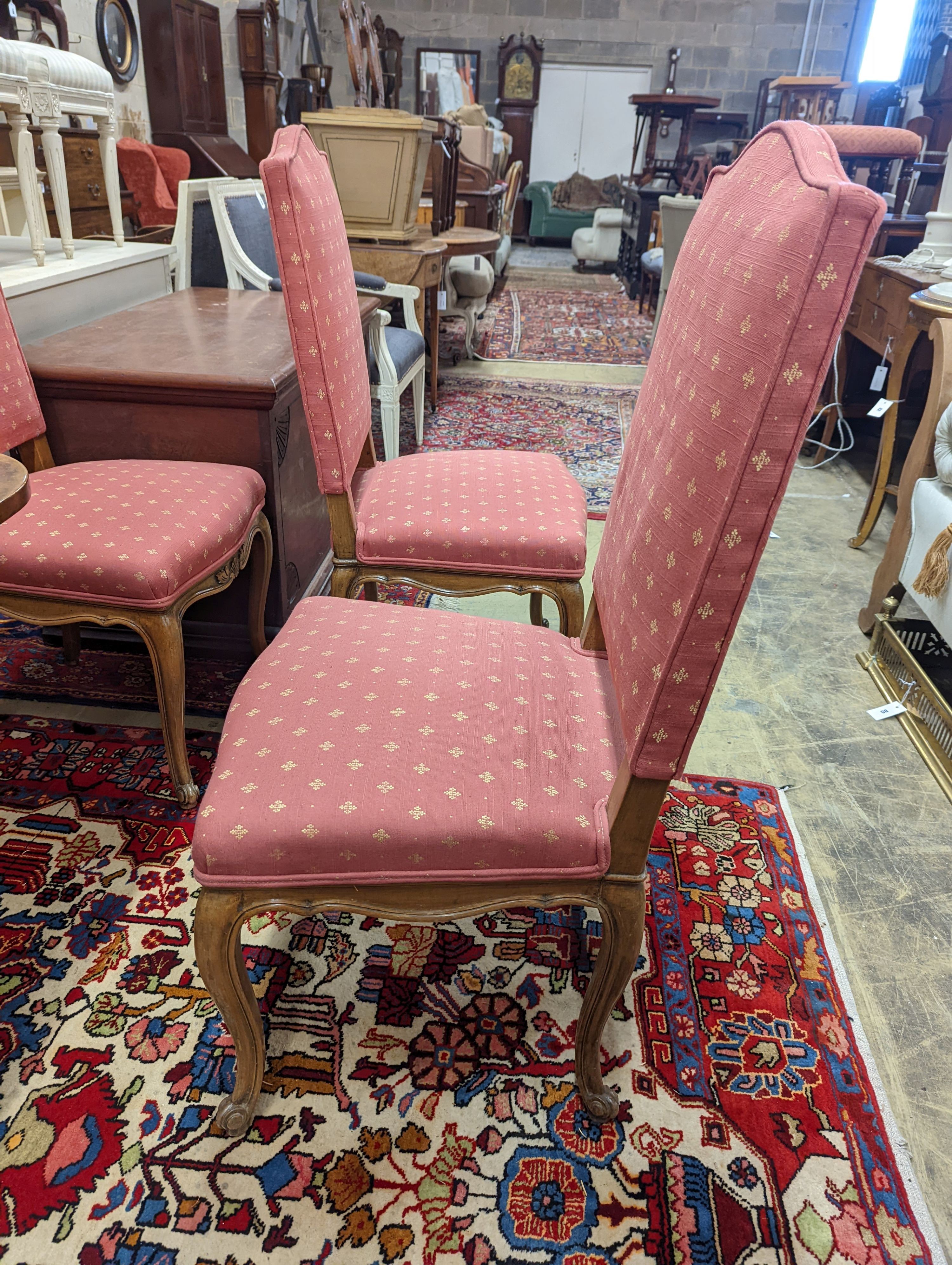 A set of eight French walnut dining chairs